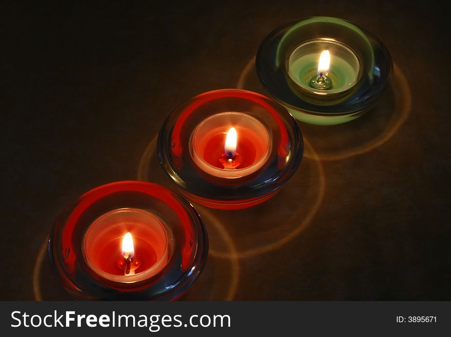 Three candles over a tablecloth
