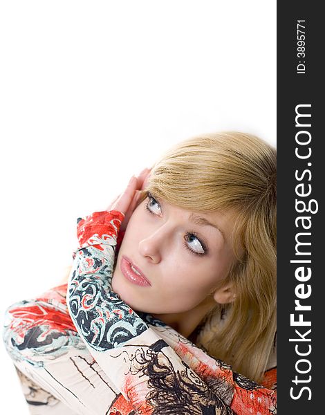 Young blonde in colored shirt staring up. Young blonde in colored shirt staring up