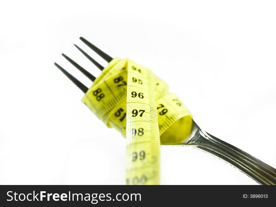Close-up of an fork with a measuring tape around it Great diet concept. Close-up of an fork with a measuring tape around it Great diet concept.