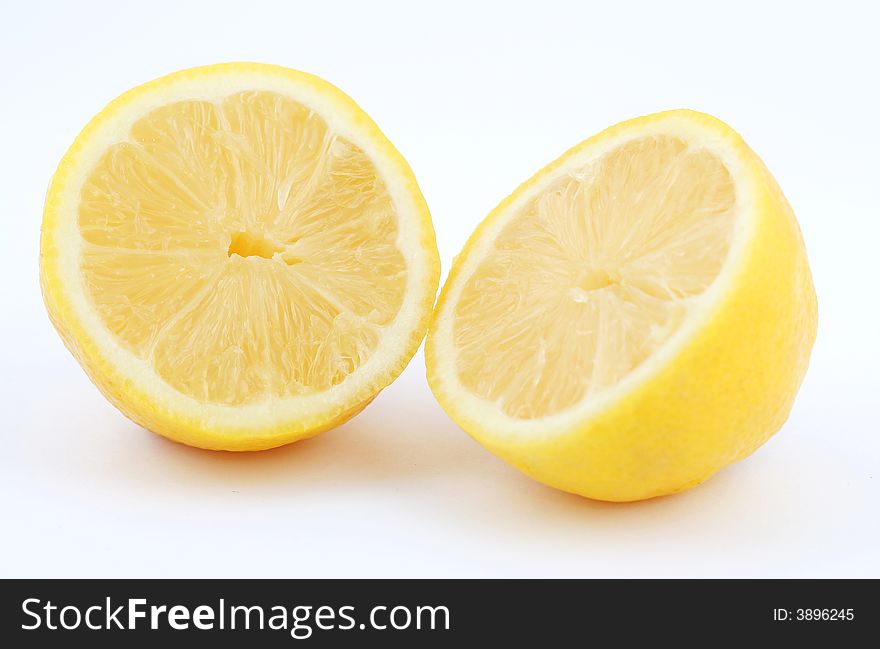 Lemon cutted in two isolated on white