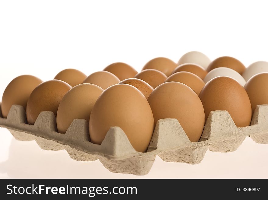 Carton of eggs on the white background