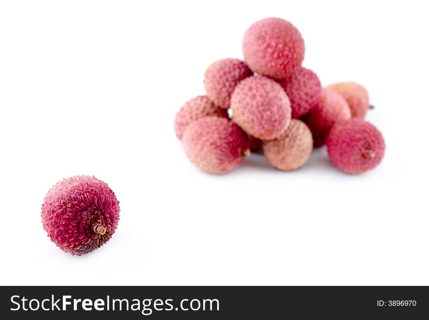 Healthy ripe pink litchies with course prickly peel. Healthy ripe pink litchies with course prickly peel