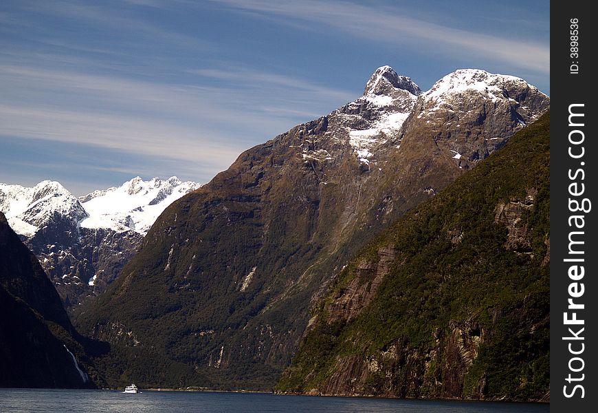 The road to Milford is one of New Zealand’s most scenic drives. The first part is relatively mild farmland, then you’ll ease into beech forest near the entrance to the Fiordland National Park. Look for the Avenue of the Disappearing Mountain and the Mirror Lakes. Beautiful Milford Sound, described by Rudyard Kipling as the ’eighth wonder of the world’. A cruise on Milford Sound will be an essential component of your time in Fiordland, or you can get up close and personal in a sea kayak. Tall waterfalls, vertical rock faces and seals are some of the things you’ll remember