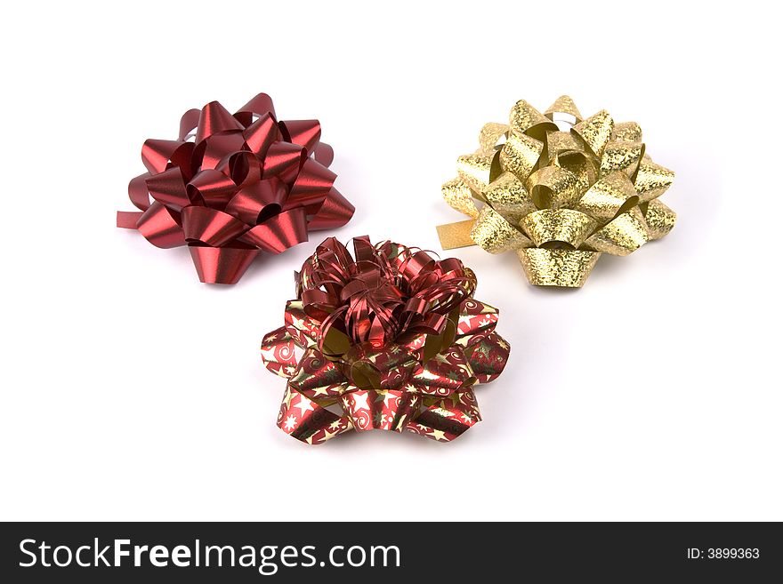 Three Christmas decoration bows against white background. Three Christmas decoration bows against white background