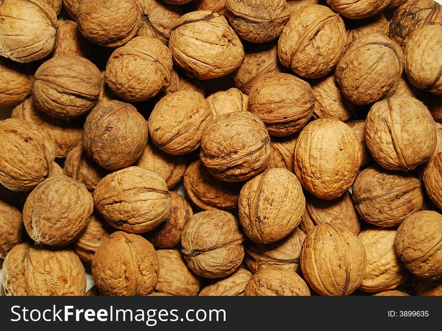 Close up of lots of walnuts in random order. Close up of lots of walnuts in random order