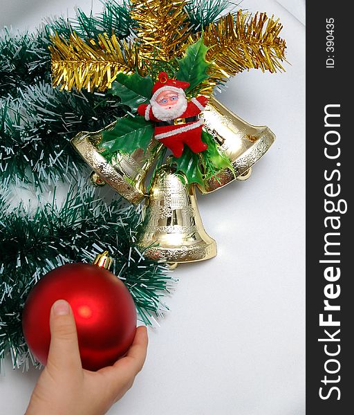 Handbells a red sphere and a bow Christmas decoration on white background