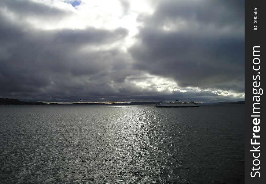 Car ferry crossing the Puget Sound to Seattle on a stormy winter afternoon. Car ferry crossing the Puget Sound to Seattle on a stormy winter afternoon.