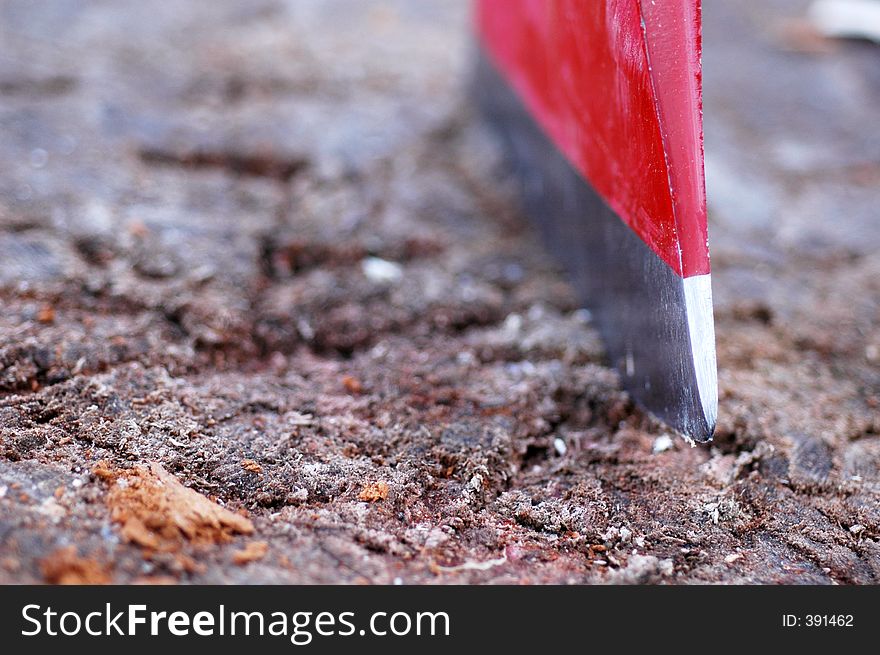 Closeup of an axe blade. Large aperture used, focus is on the foreground part of the blade, the rest is blurred.