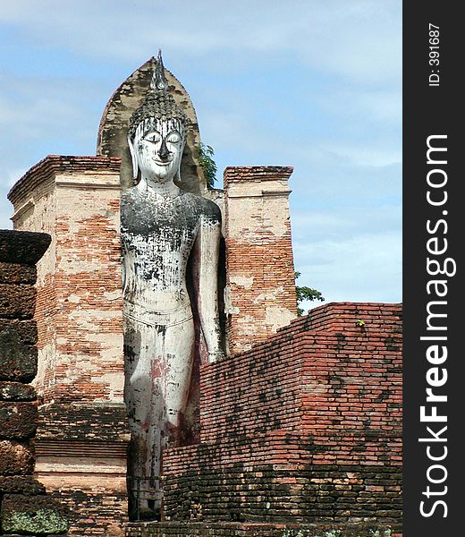 Thai Temple with a standing Buddha