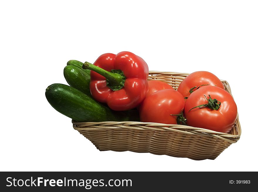 Basket with vegetables on white background