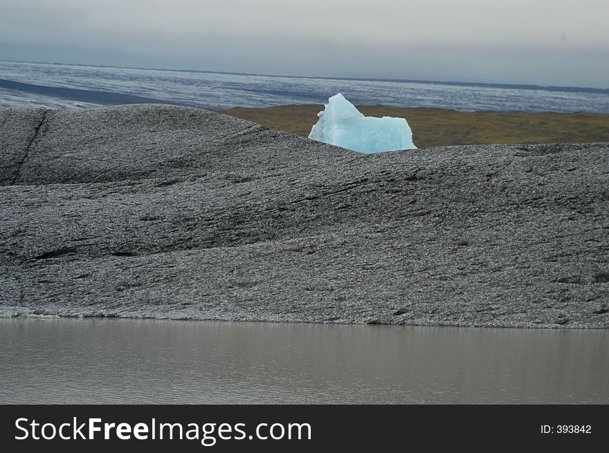 Small Iceberg on Rock and Water