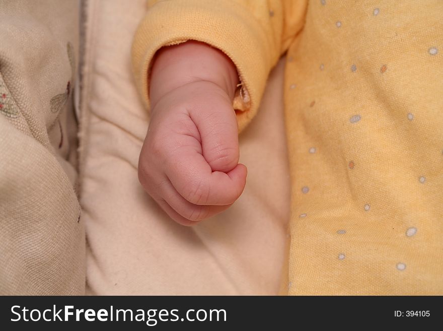 Baby hand in crib