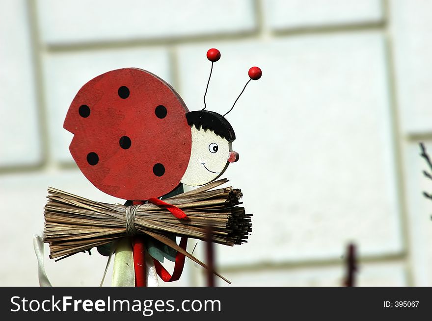 One lady bird, decoration for the garden