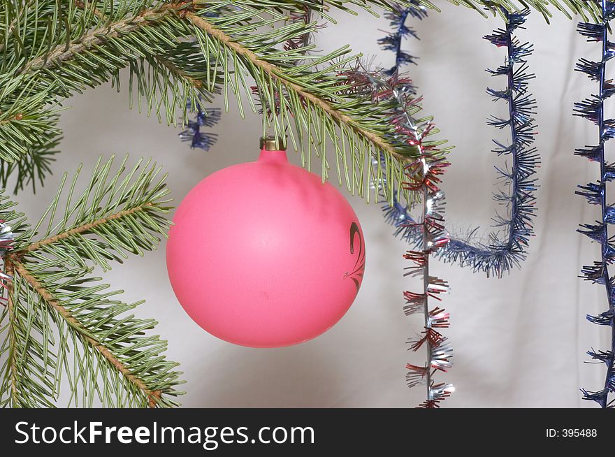 Pink christmas ball and tinsel