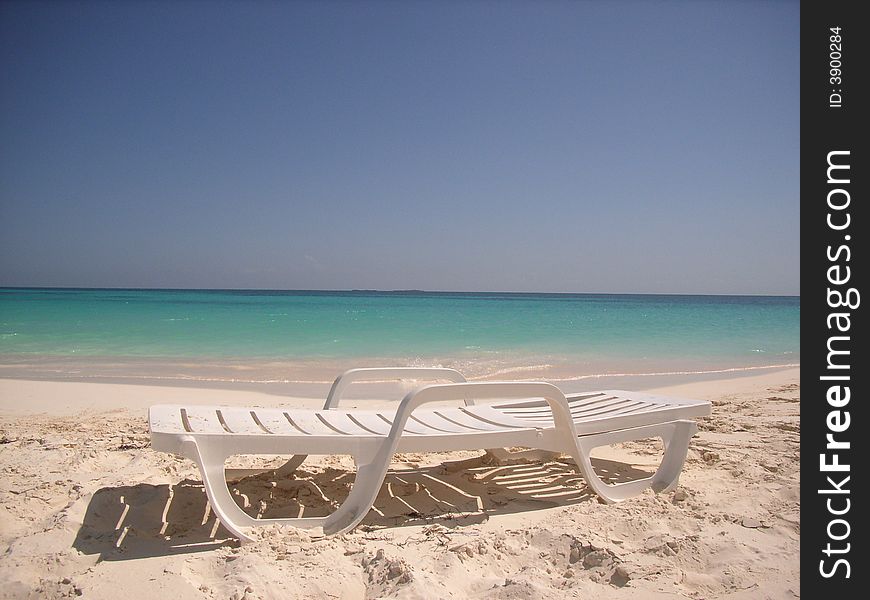 Beach chair at a beach in the Caribbean. Beach chair at a beach in the Caribbean