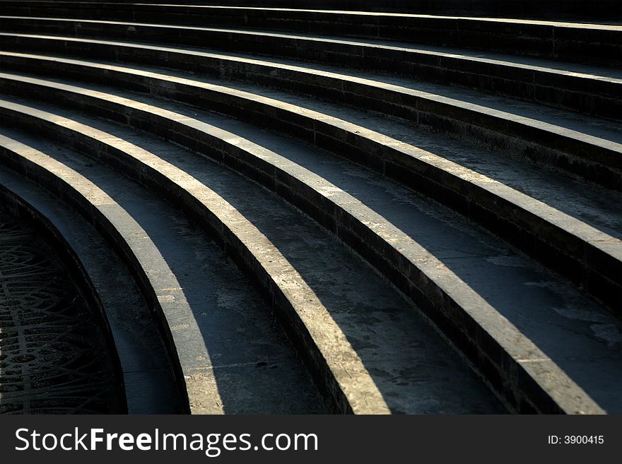 Curved lines on concrete step. Curved lines on concrete step