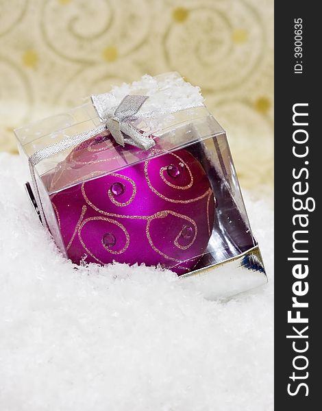 Festive new-year candle in box with snow