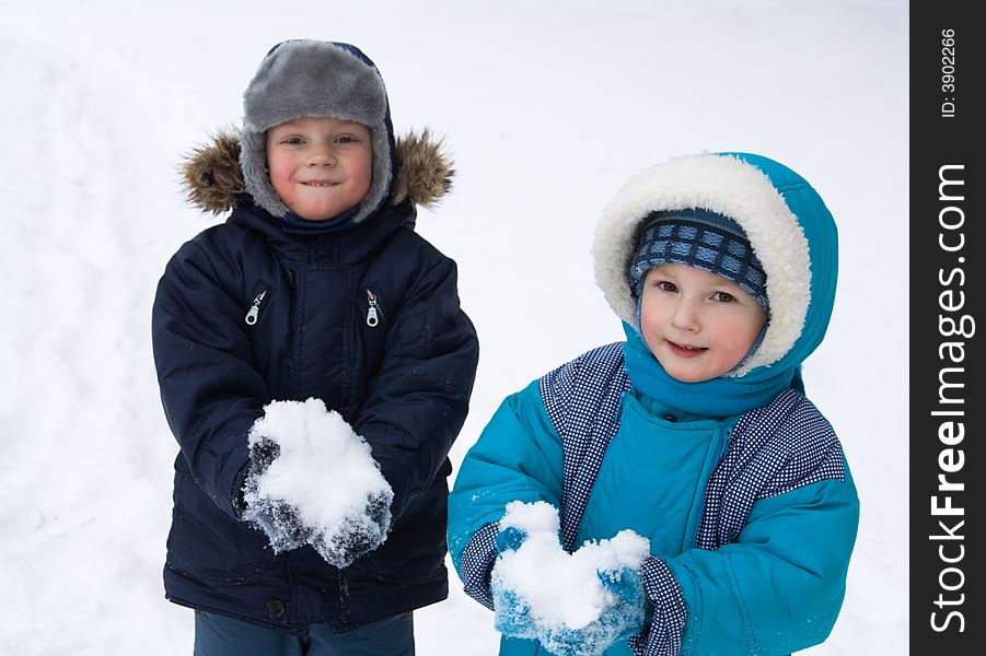 Little boys play winter day. Little boys play winter day