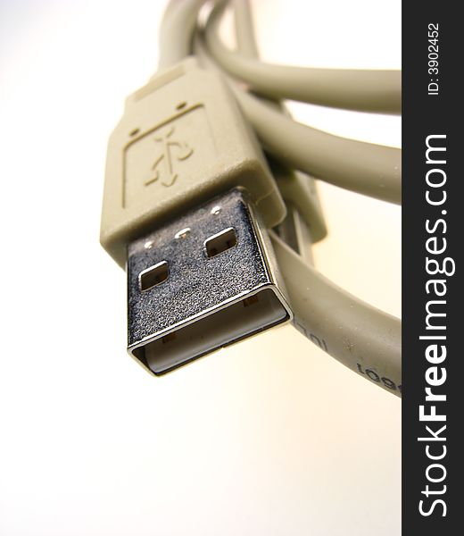 Computer connecting cable on light background, close up. Computer connecting cable on light background, close up