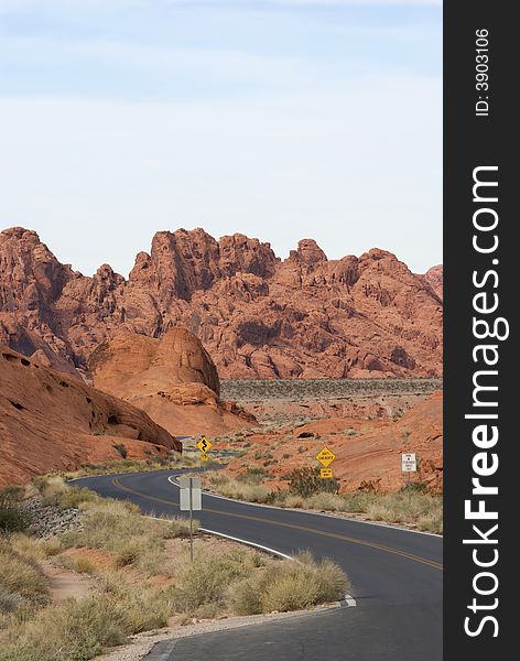 Curved empty road in desert mountain