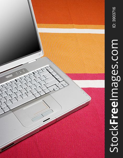 Laptop On A Colorful Rug