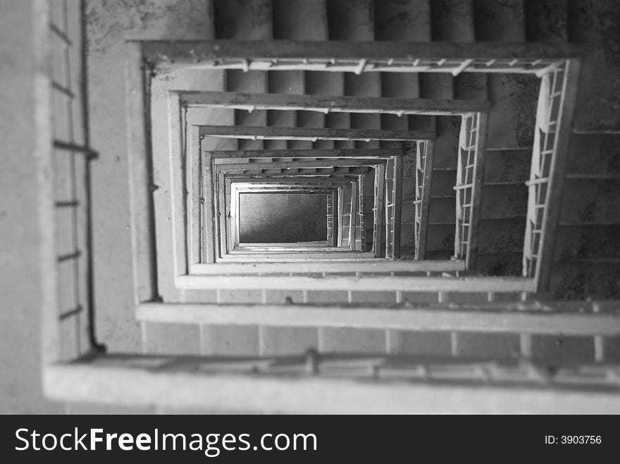 Looking down a staircase with railings. Looking down a staircase with railings....