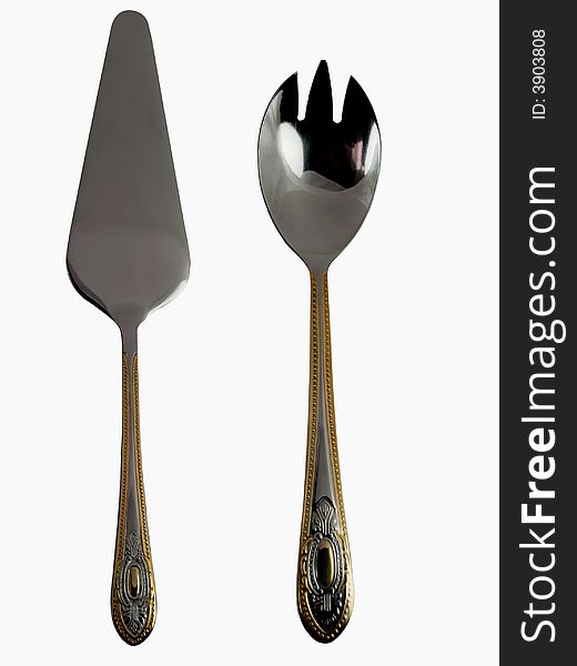 Golden serving utensils for desserts and salads