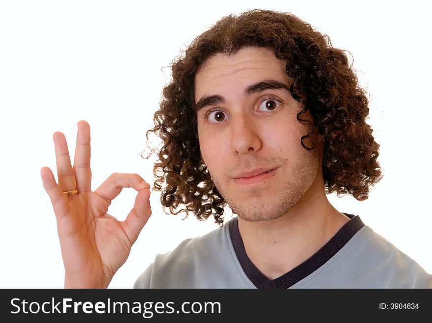 Casual young man giving the OK hand gesture, isolated on white. Casual young man giving the OK hand gesture, isolated on white