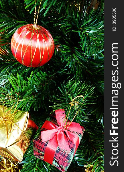 Close-up of Christmas decorations on a tree. Close-up of Christmas decorations on a tree.