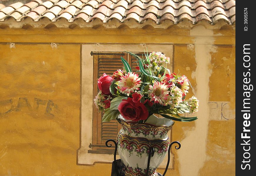 A flowerpot in an old French village. A flowerpot in an old French village