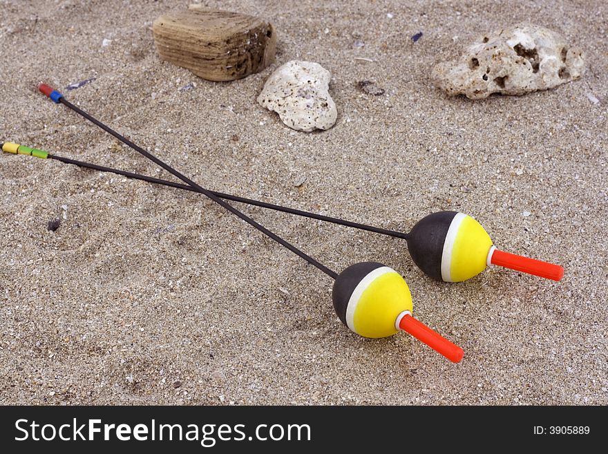 Fishing floats in the sand