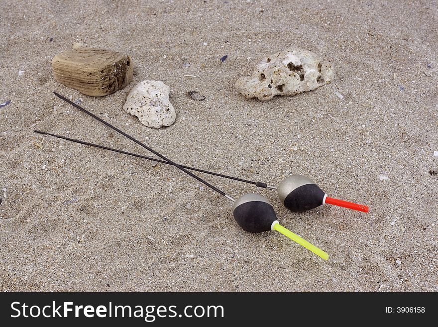 Fishing floats in the sand