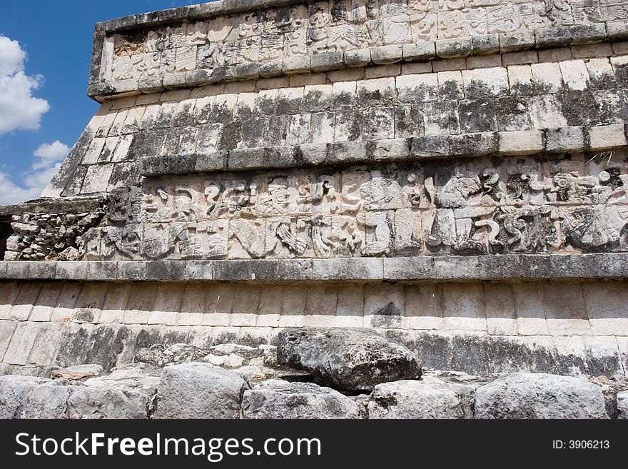 Mayan figures carved into the old stone wall at Chichen Itza. Mexico. Mayan figures carved into the old stone wall at Chichen Itza. Mexico