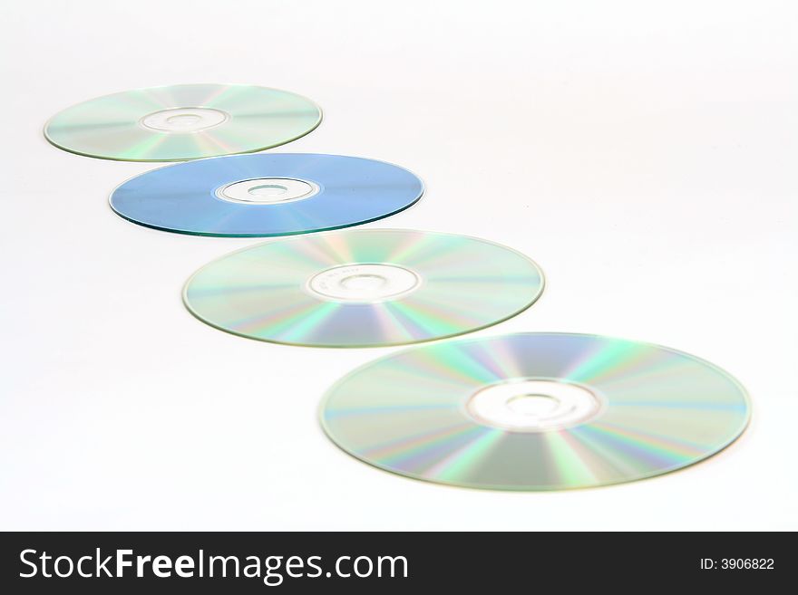 4 cds in a row - 1 blue, 3 silver. 4 cds in a row - 1 blue, 3 silver