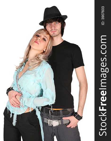 Boy in black hat embraces girl in cyan blouse on white