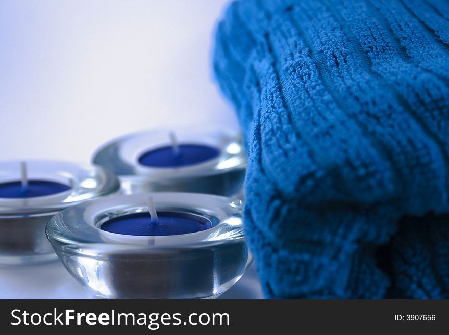 Blue towel and three candles. Blue towel and three candles