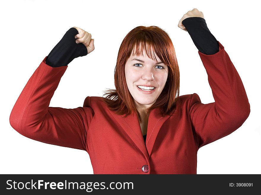 Cute girl with red hair dressed in a red business dress with her arms raised smiling and rejoicing for a win. Studio shot. Cute girl with red hair dressed in a red business dress with her arms raised smiling and rejoicing for a win. Studio shot.