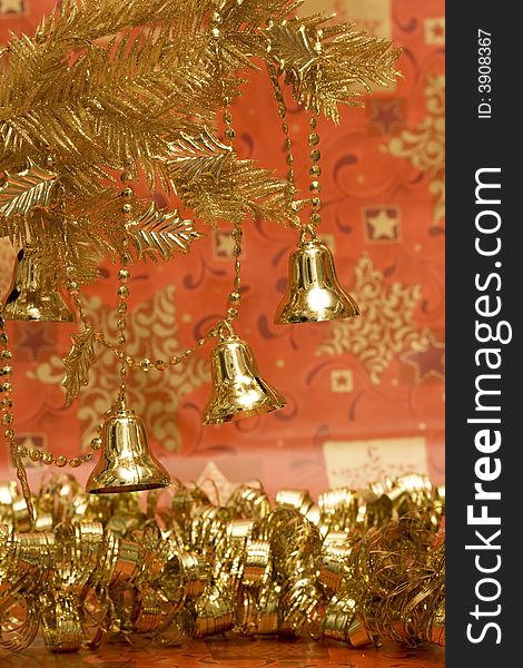 New-year handbells and Christmas tree on red background
