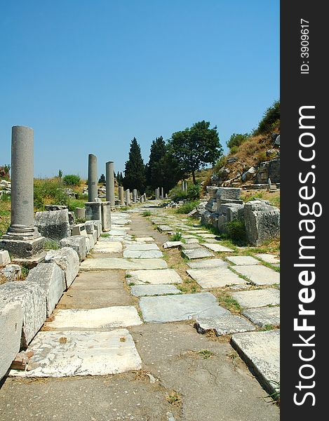 Roman street in Ephesus, Turkey with columns and arches. Roman street in Ephesus, Turkey with columns and arches