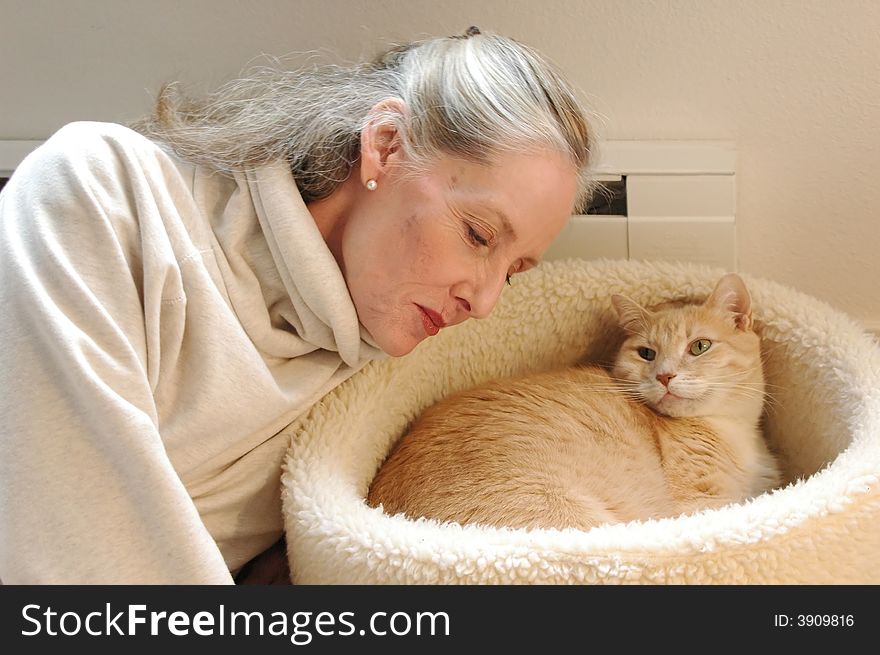 Mature female beauty with her cat. Mature female beauty with her cat.