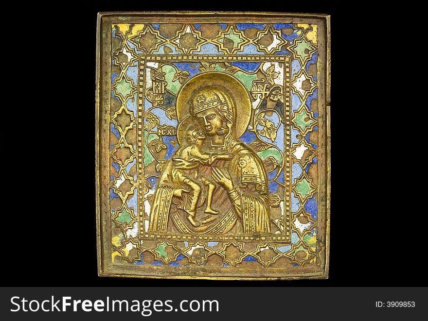 An ancient madonna metallic icon. An ancient madonna metallic icon