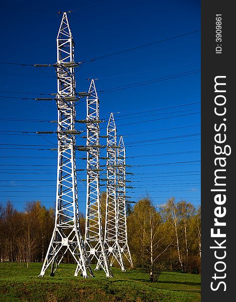 Solitary electricity pylons - against a blue sky. Solitary electricity pylons - against a blue sky