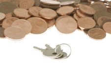 Bunch Of Keys In Front Of Pile Of Cents Royalty Free Stock Photography