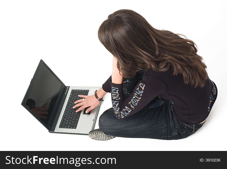 Young brunette girl in black with lap top computer representing modern communications. Young brunette girl in black with lap top computer representing modern communications.