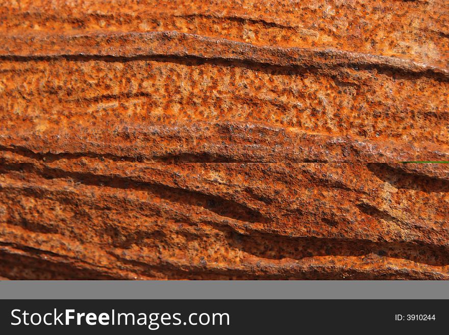 A rusty gullied plaque to be used as backgrounf or texture
