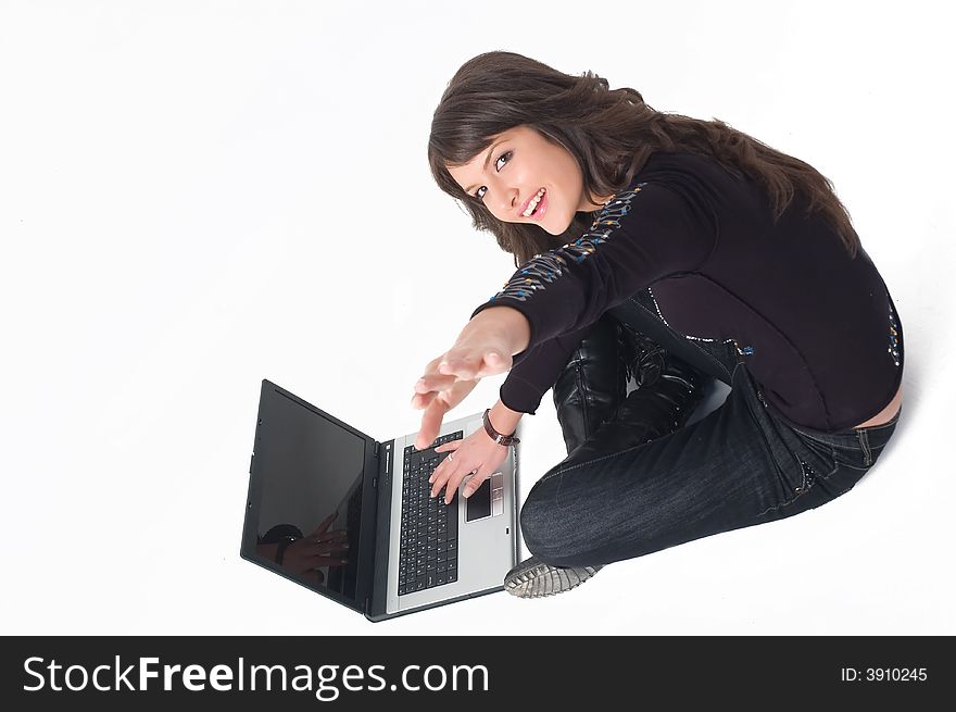 Young brunette girl in black with lap top computer representing modern communications. Young brunette girl in black with lap top computer representing modern communications.