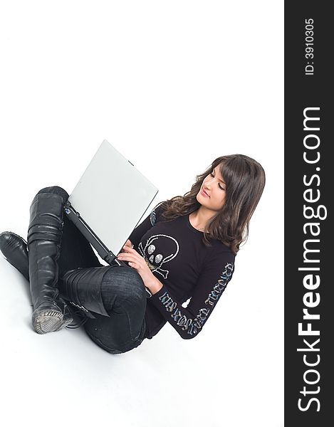 Young brunette girl in black with lap top computer representing modern communications. Young brunette girl in black with lap top computer representing modern communications.