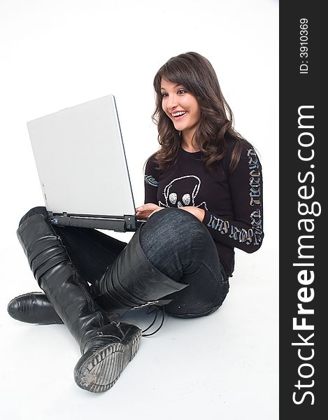 Young brunette girl in black with lap top computer representing modern communications. Young brunette girl in black with lap top computer representing modern communications.