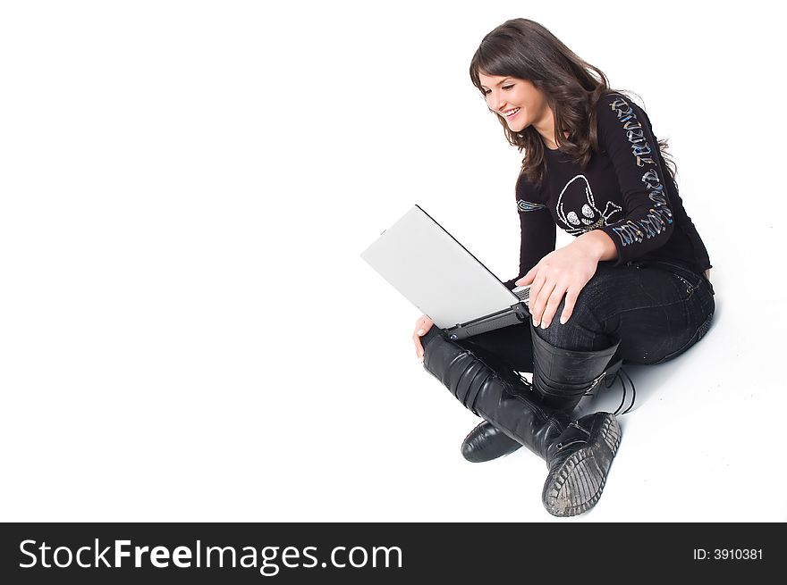 Young brunette girl in black with lap top computer representing modern communications. Young brunette girl in black with lap top computer representing modern communications.