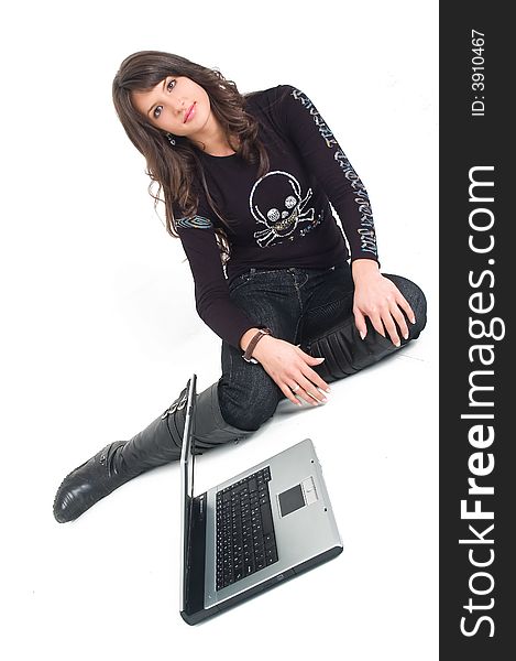 Young brunette girl in black with lap top computer representing modern communications. Young brunette girl in black with lap top computer representing modern communications.